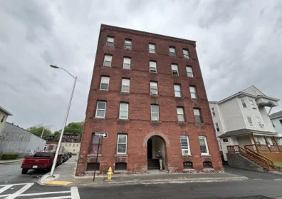Ten-unit brick multifamily apartment building in Worcester, Massachusetts, financed with a permanent loan