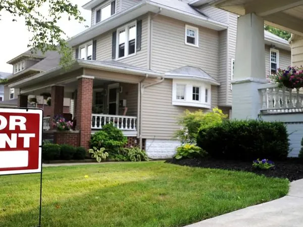 Single-family rental home with a for rent sign