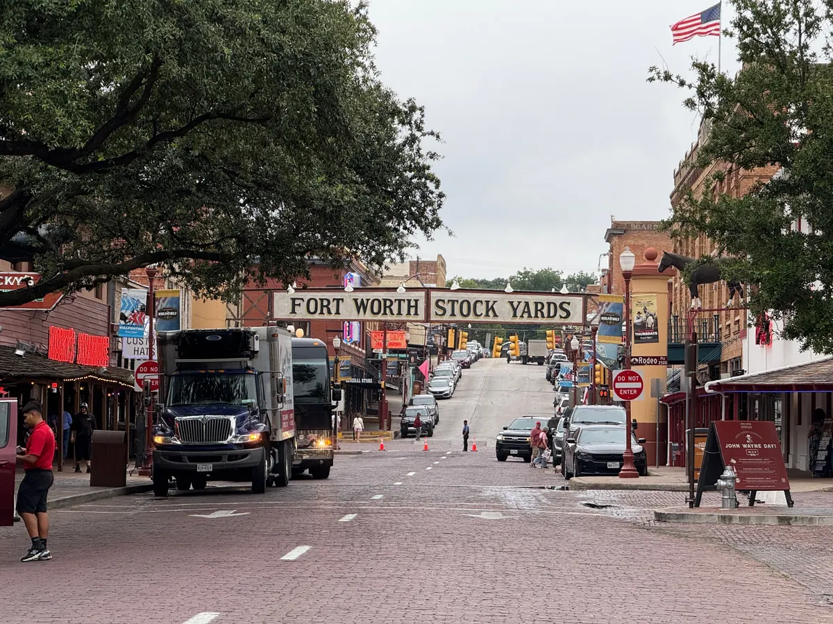 Fort Worth Stock Yards entrance on a brick street