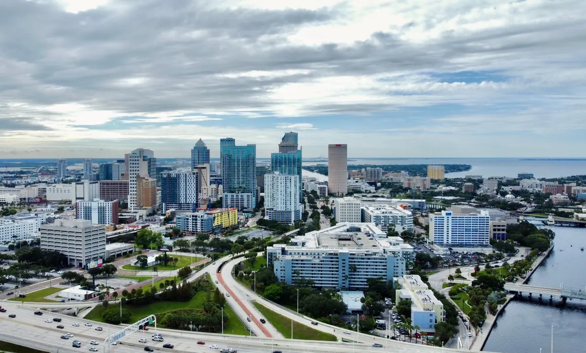 Aerial view of downtown Tampa and Hillsborough Bay under a cloudy sky